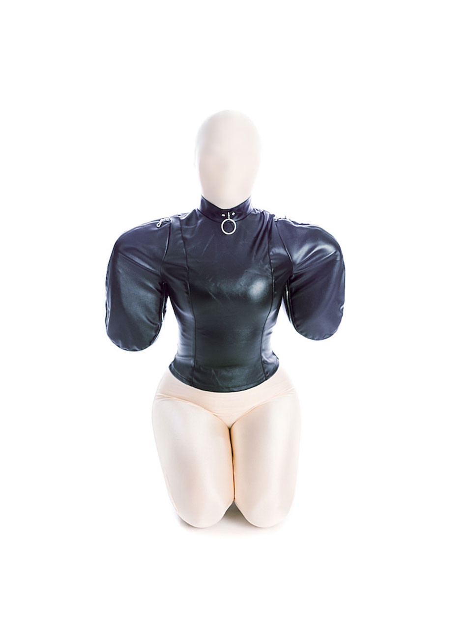Front view of submissive kneeling in zipped arm binder straitjacket with O-ring collar