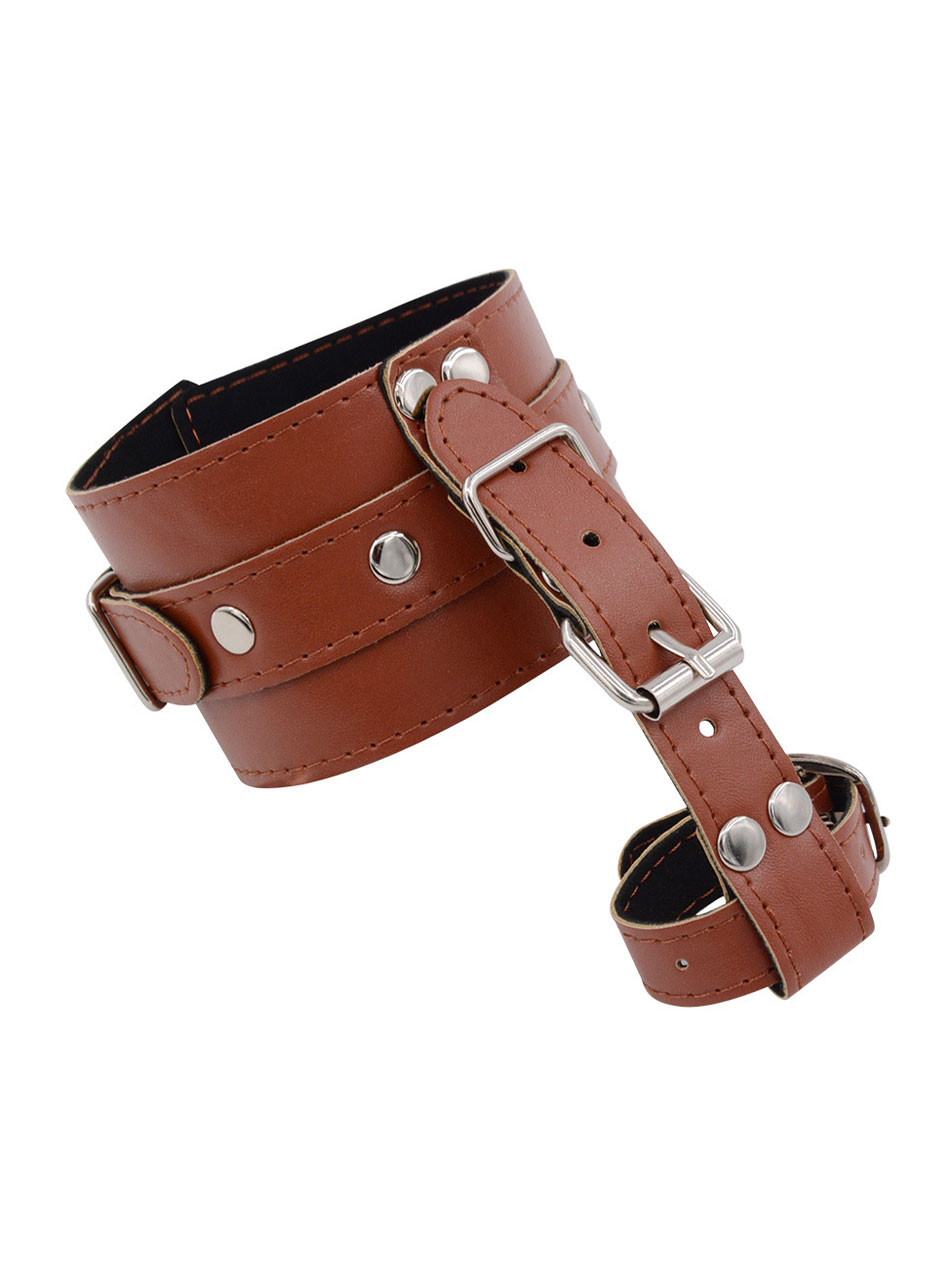 Strap your sub into this rich brown PU leather restraint, binding their thumb to their wrist to eliminate their ability to resist. The dual-buckle system allows you to cinch it down tight, holding their hand in a vulnerable, immobile position that screams submission. Every movement reminds them of your control as the smooth leather hugs their skin, ready for extended teasing or intense sessions.