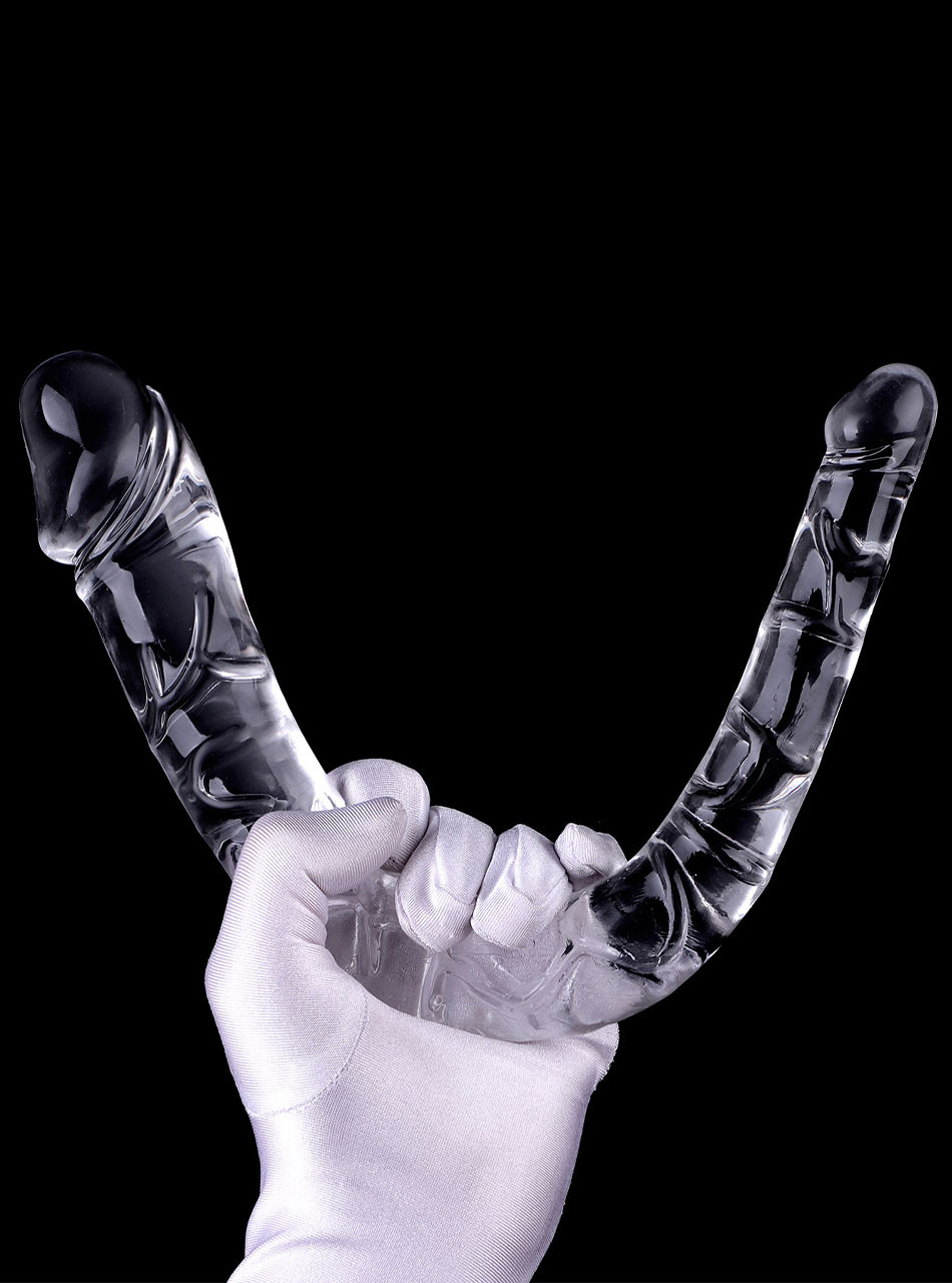Hand holding flexible TPE double dildo bent into a U-shape