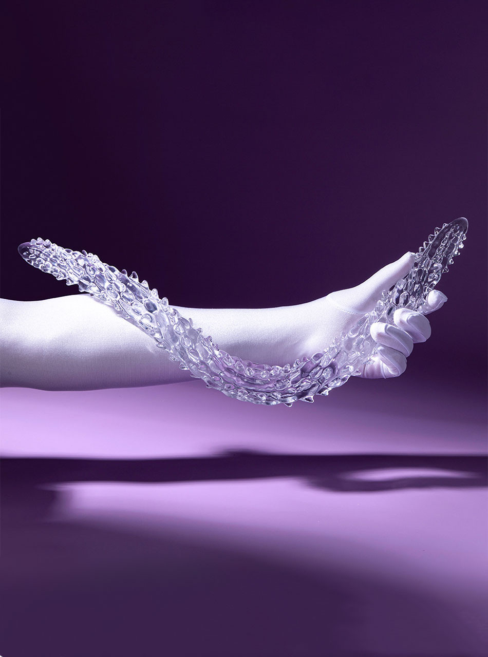 Flexible TPE wand bent into a curve to demonstrate softness and elasticity.