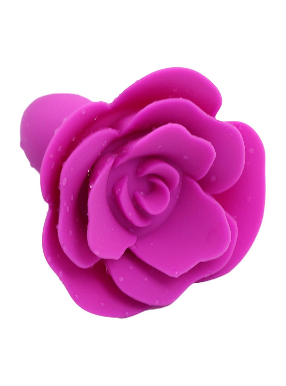 Bright pink rose shaped anal plug close-up detail