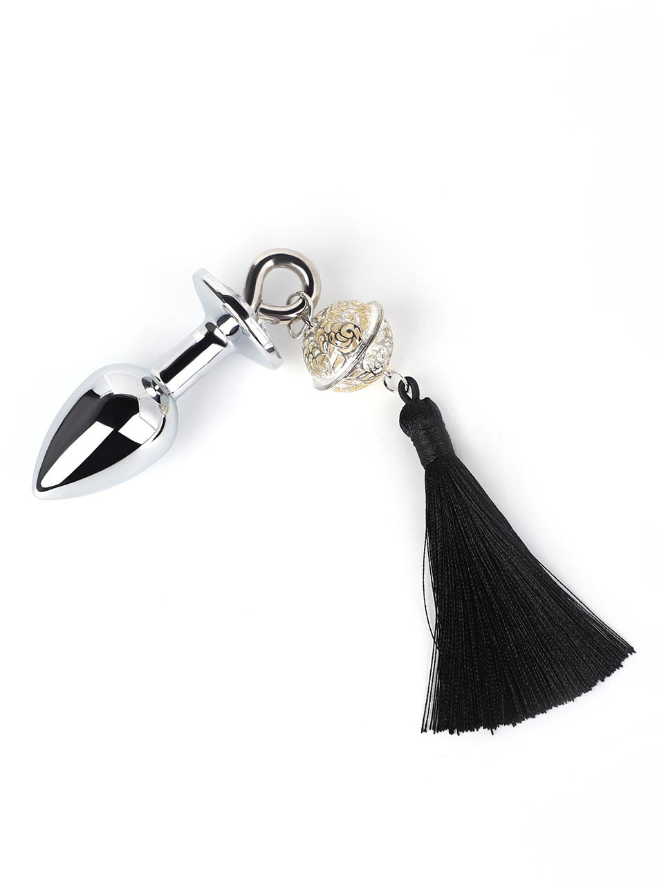 Silver metal butt plug with black tassel, decorative bell, and charm ring
