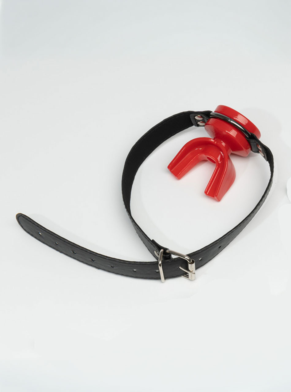 Red silicone piss play mouth gag with adjustable black strap