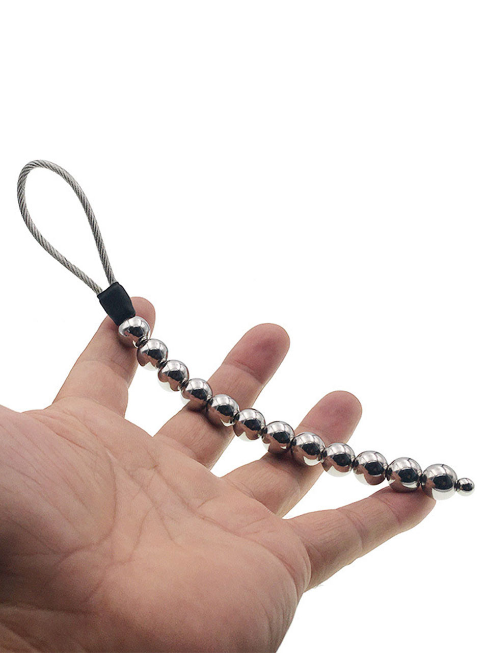 Stainless steel anal beads shown in hand with polished silver beads and cable loop
