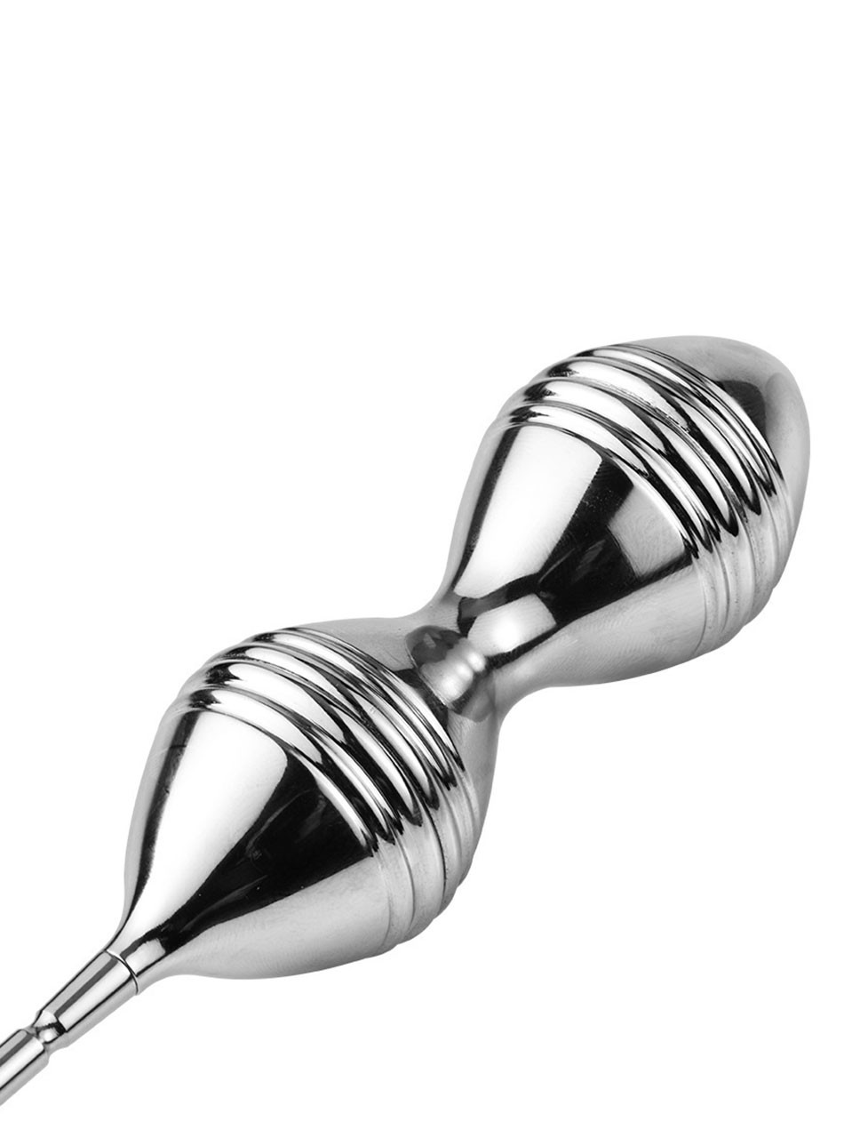Close-up of a silver double metal Kegel ball trainer with tapered ends and raised ribbed texture