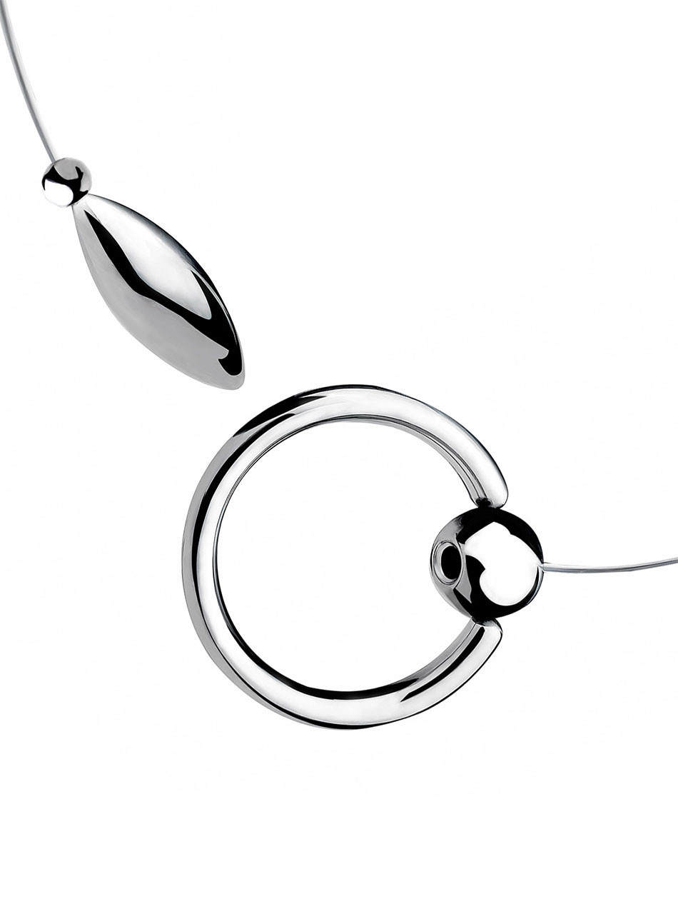 Close-up of 304 stainless steel tethered urethral plug with rigid open cock ring.