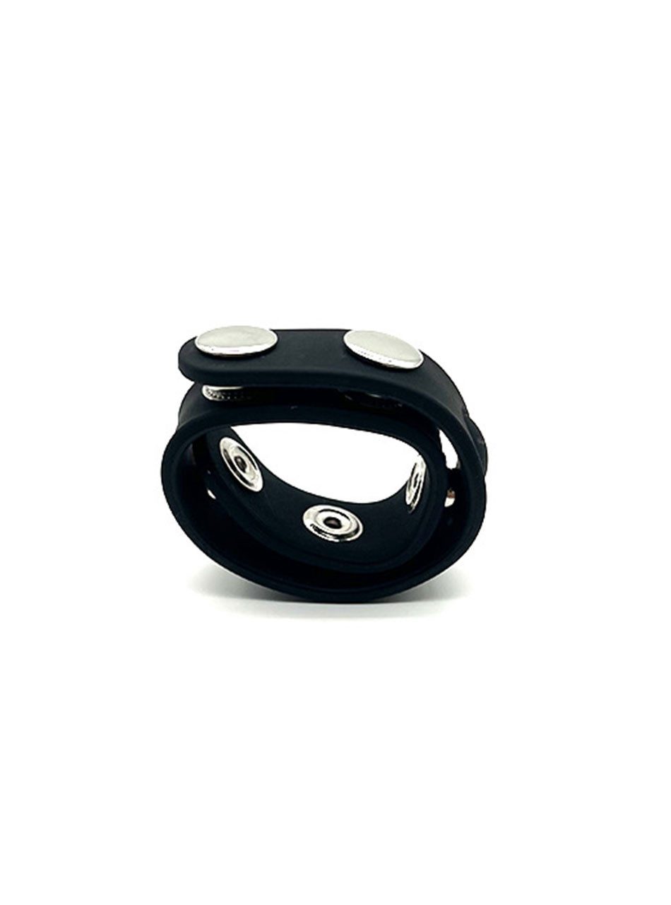 Adjustable black silicone cock ring fastened into a compact circular shape.