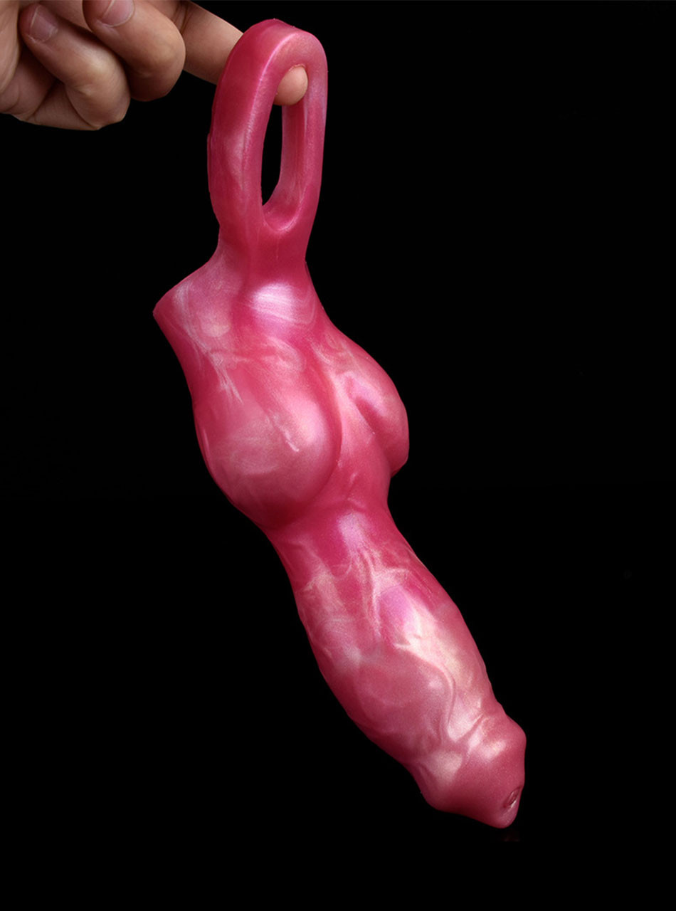 Rear view of red marbled canine penis sleeve showing the integrated grey ball loop held by hand