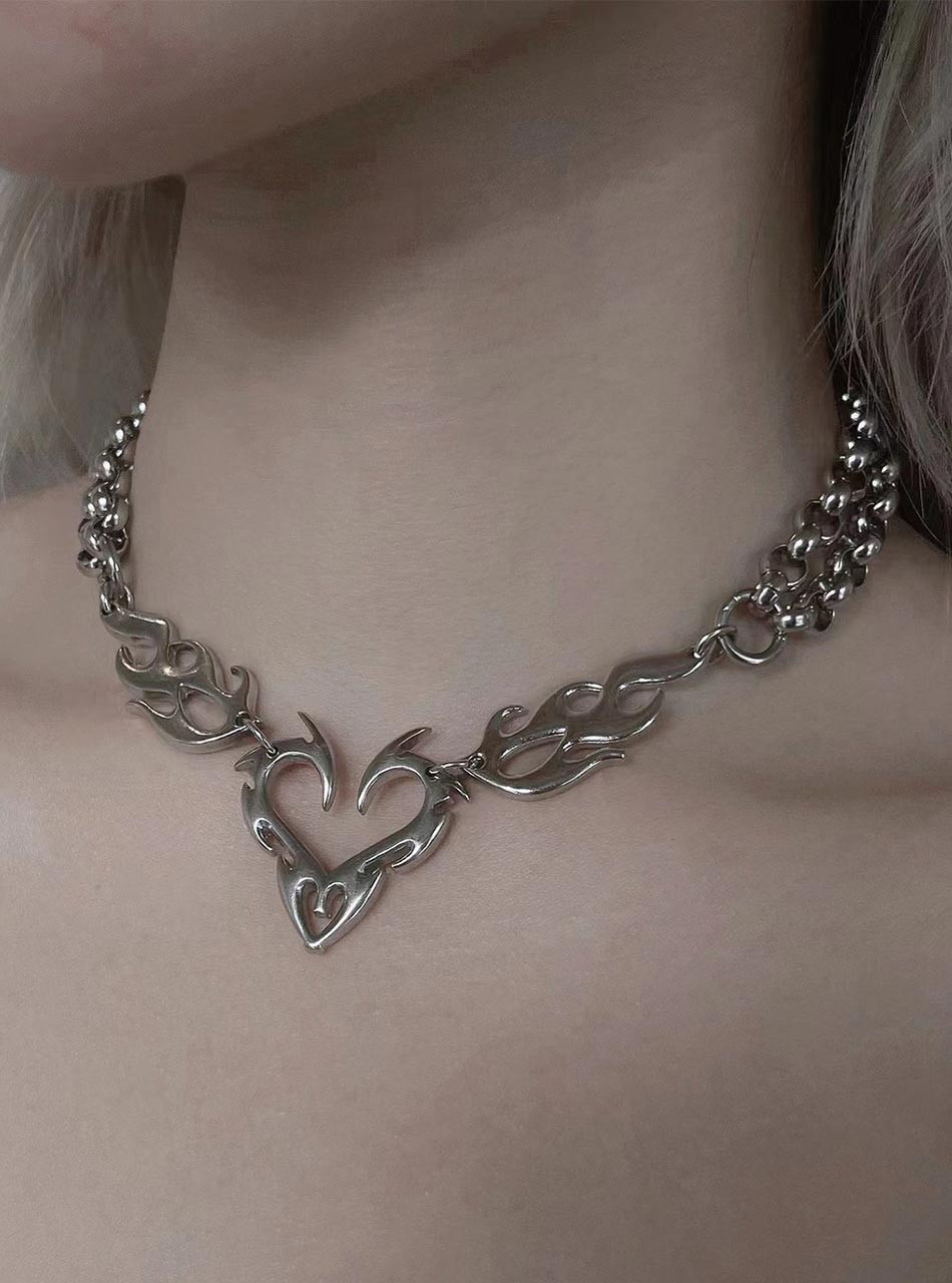 Silver flame heart chain necklace close-up