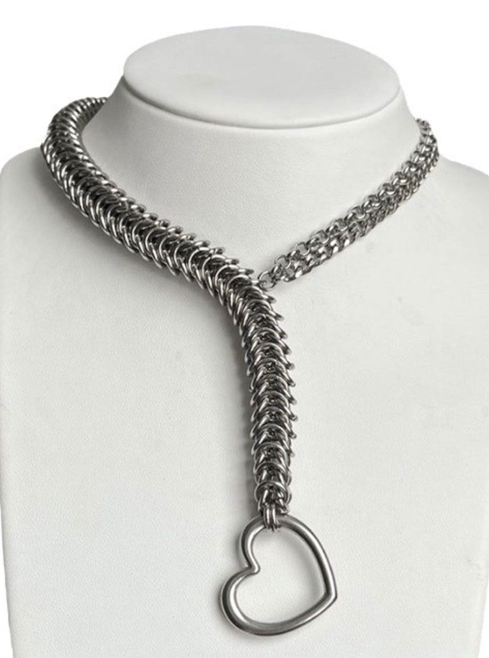 Silver heart lariat necklace displayed on jewellery stand