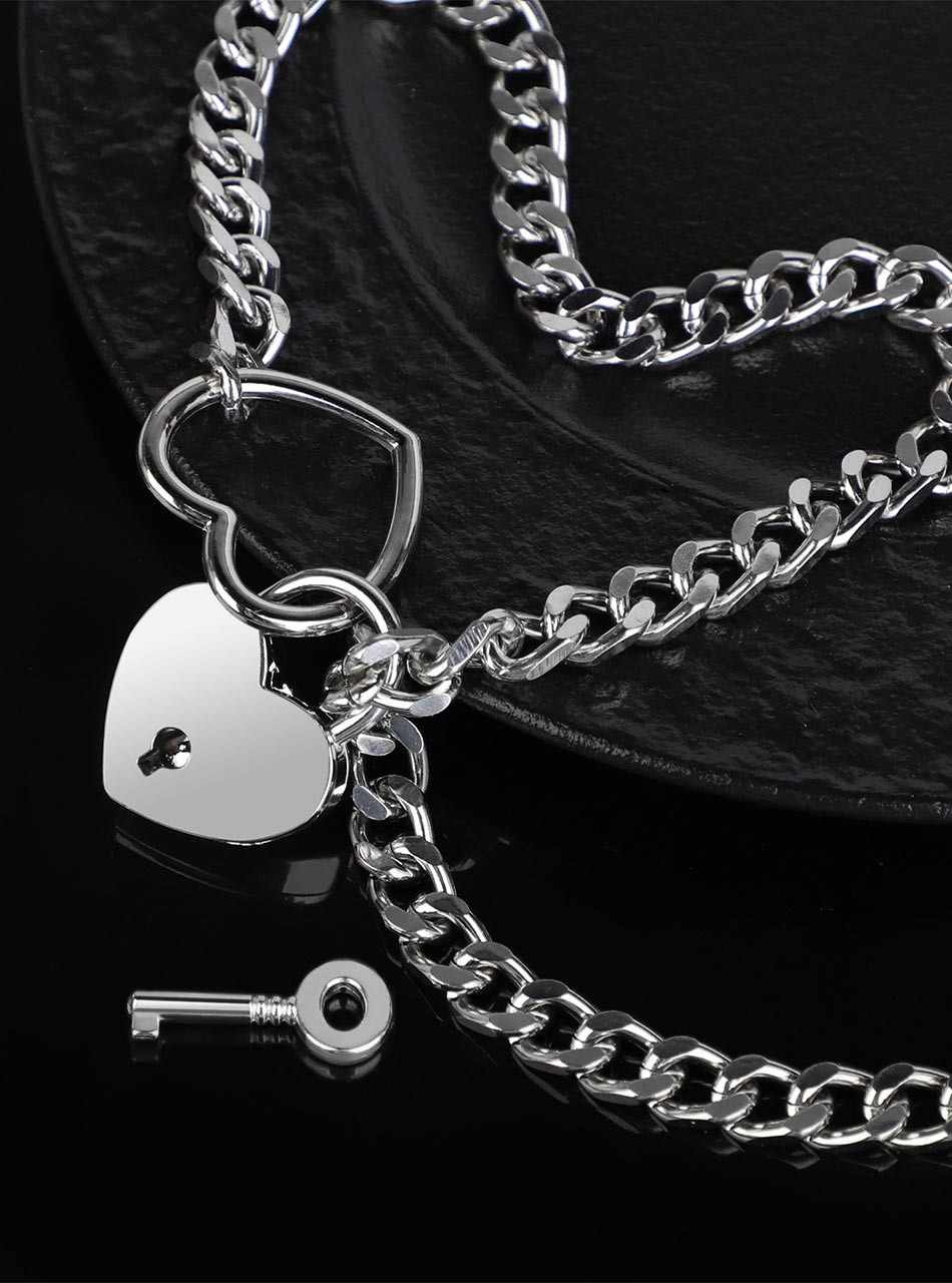 Silver heart padlock collar with key close-up