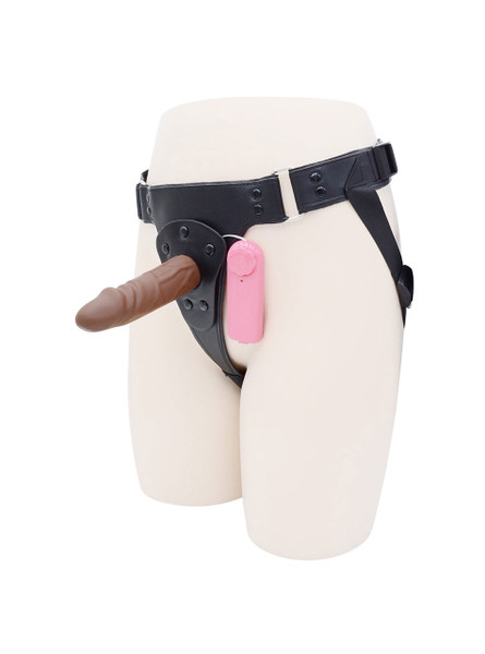 Brown strap-on harness with vibrating brown dildo and pink controller attached