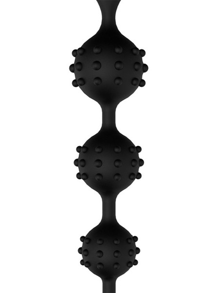 Close-up of textured spiked anal beads for intense stimulation.