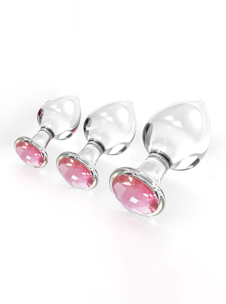 Pink gem crystal glass butt plug set in three sizes with clear glass bodies and faceted pink jewel bases