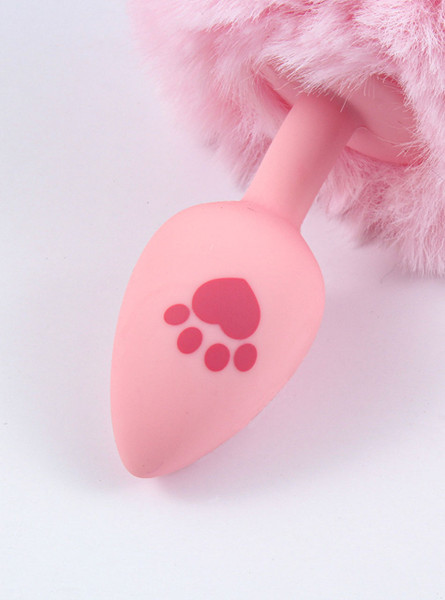 Baby pink fox tail butt plug with a playful paw print, combining comfort and fantasy for a unique intimate experience.