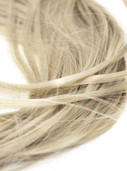 Close-up of the soft, flowing blonde tail of the pet play anal plug, highlighting its natural elegance.