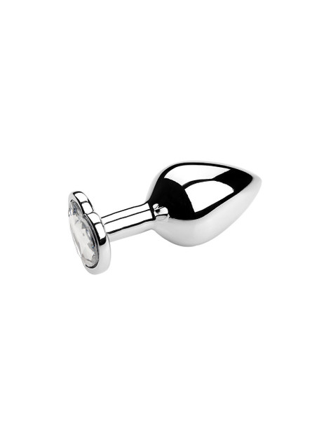 White heart jewel metal butt plug on a reflective surface, ideal for enhancing anal play.