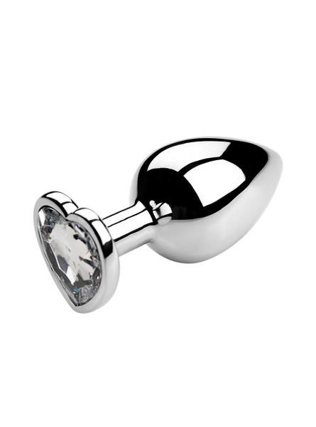 White heart jewel metal butt plug on a reflective surface, ideal for enhancing anal play.
