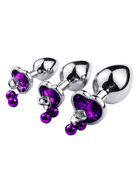 Close-up of purple heart jewel on metal butt plug