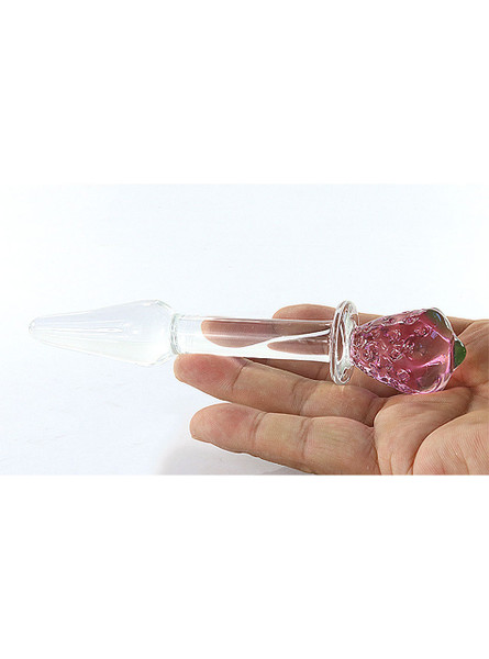 Strawberry Delight Crystal Glass Butt Plug featuring a charming strawberry design on the flared base, with a smooth and clear tapered shaft for easy insertion. Ideal for visually stunning and safe anal play.