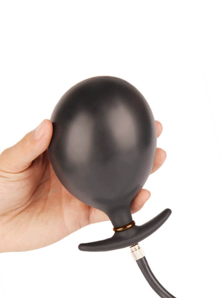 Hand holding the Inflatable Silicone Anal Balloon fully inflated, demonstrating its size.