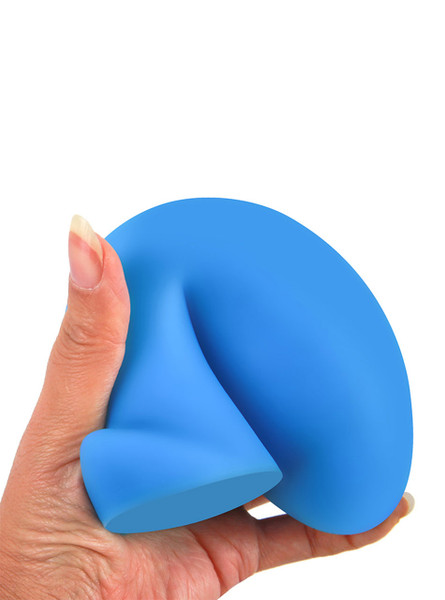 Hand squeezing squishy silicone anal plug to show flexibility