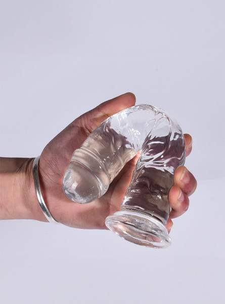 Ultra-soft clear dildo bent to demonstrate flexibility.