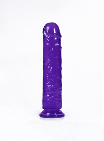 Glossy purple dildo standing upright on suction base