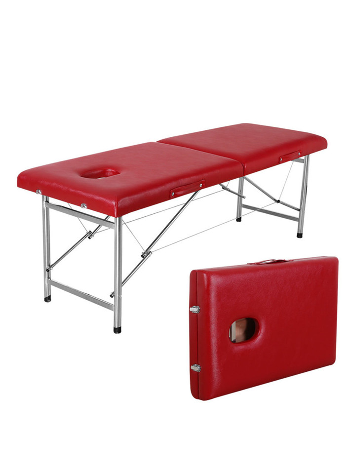 Burgundy PU sensual massage table with stainless steel legs, unfolded flat with face hole exposed.