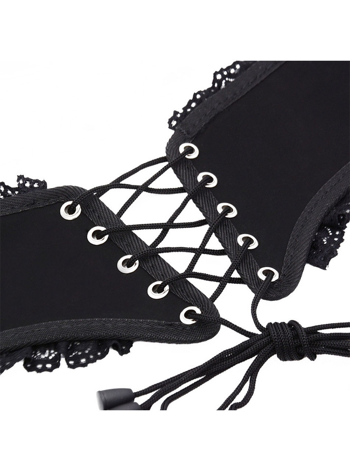 Detailed image of corset lacing and delicate lace trim.