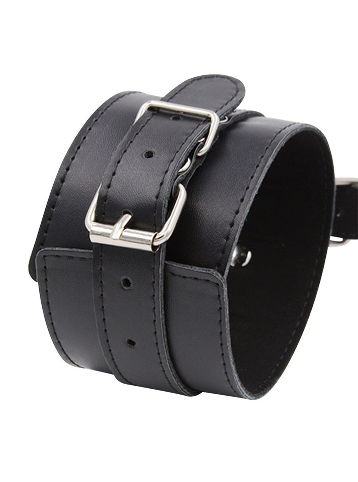 Close-up of PU leather material and metal buckles on restraint cuff