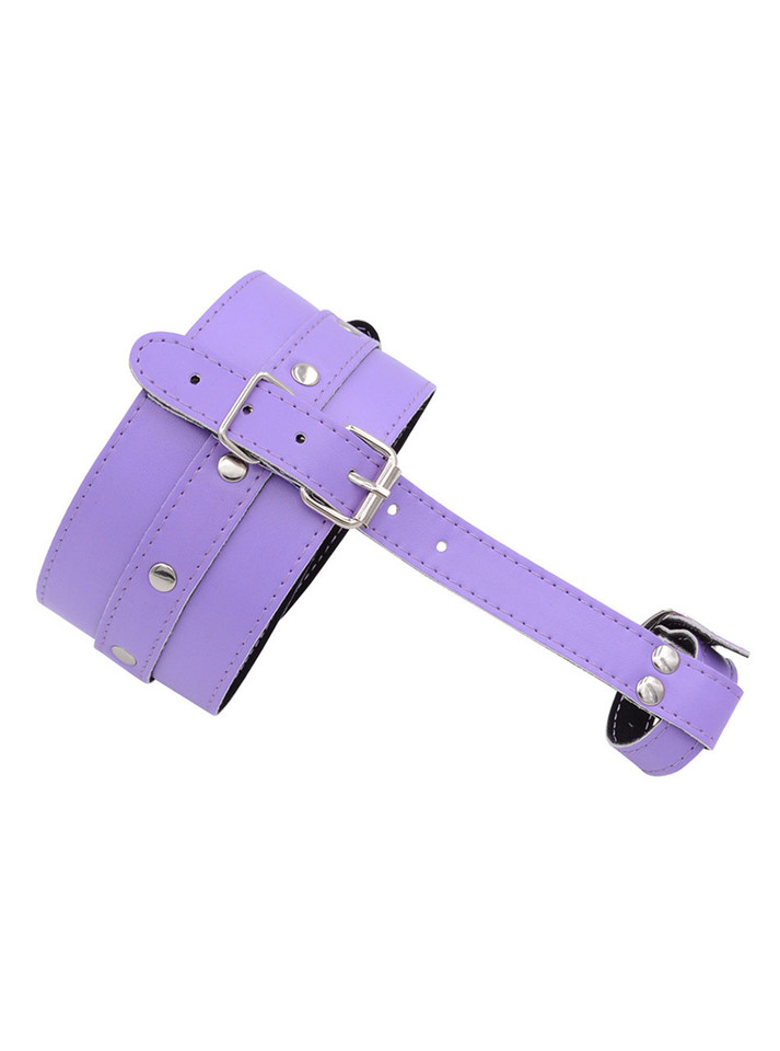 Close-up of lilac foot restraint showing stitching and buckle detail