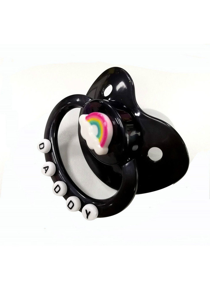 All-black adult pacifier gag with silicone nipple, crocodile-textured adjustable strap, rainbow detail, and "DADDY" letter beads; designed for DDLG, ABDL, and kink play.