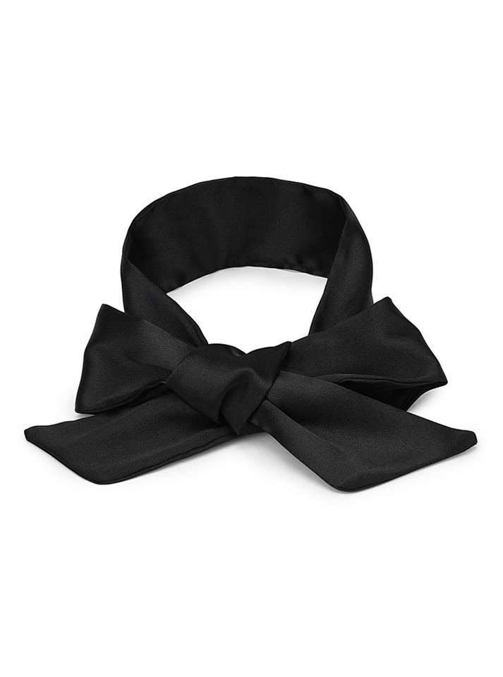 Flat black satin ribbon laid out to show material and length