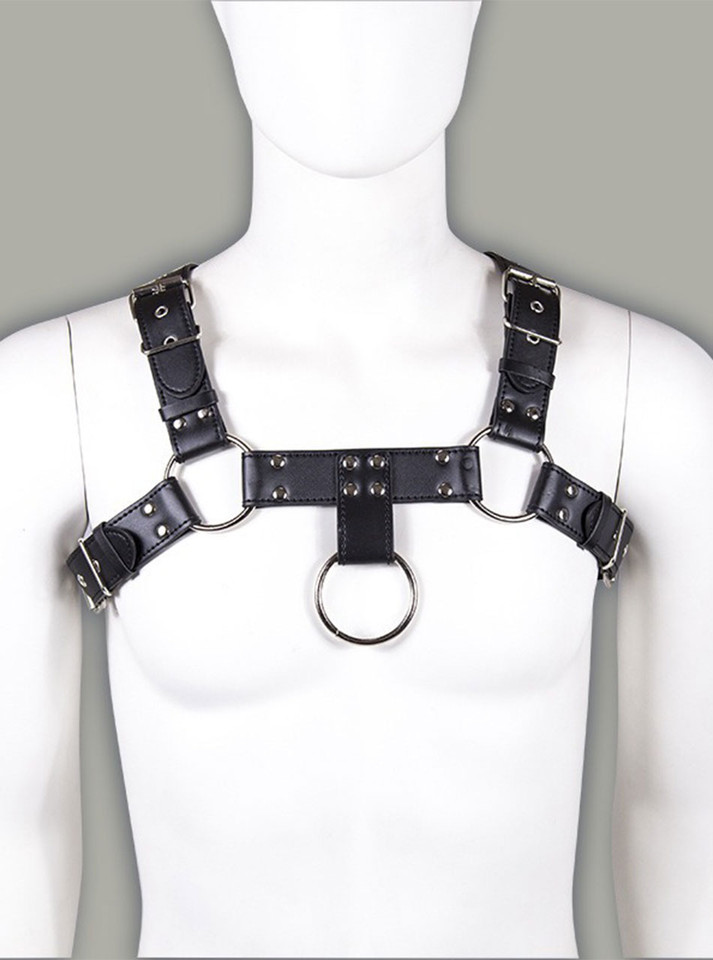 Front view of all-black chest harness with adjustable buckles and metal rings