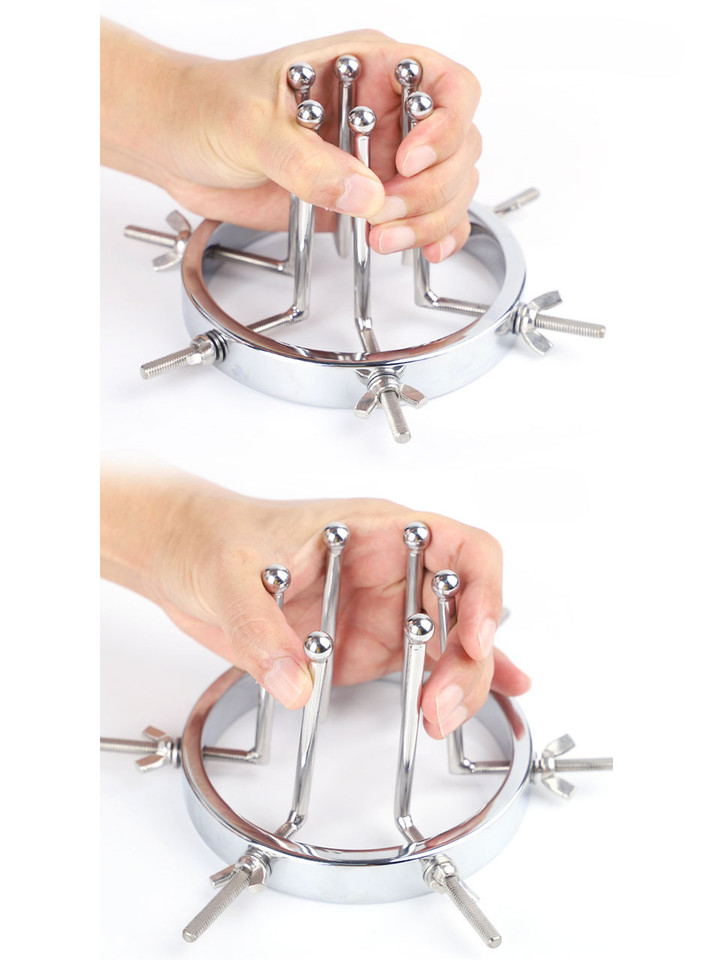 anal expander frame held in hand showing scale and structure
