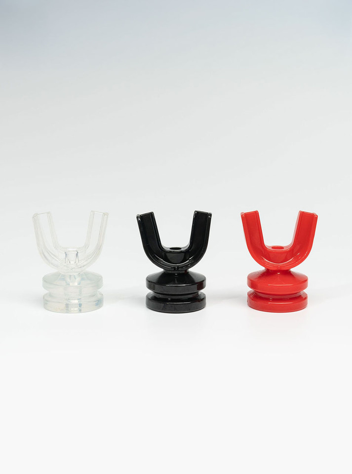 Clear, black, and red U-shaped mouth gag pieces for piss play