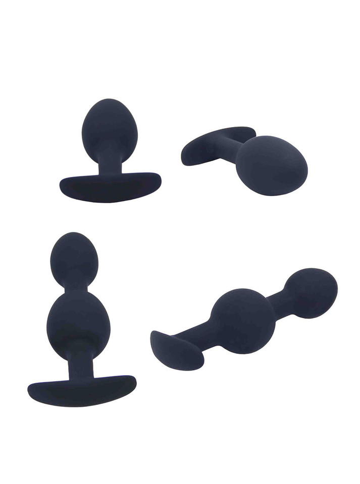 3 piece black silicone anal training set showing rounded plug and dual-bulb trainers from different angles