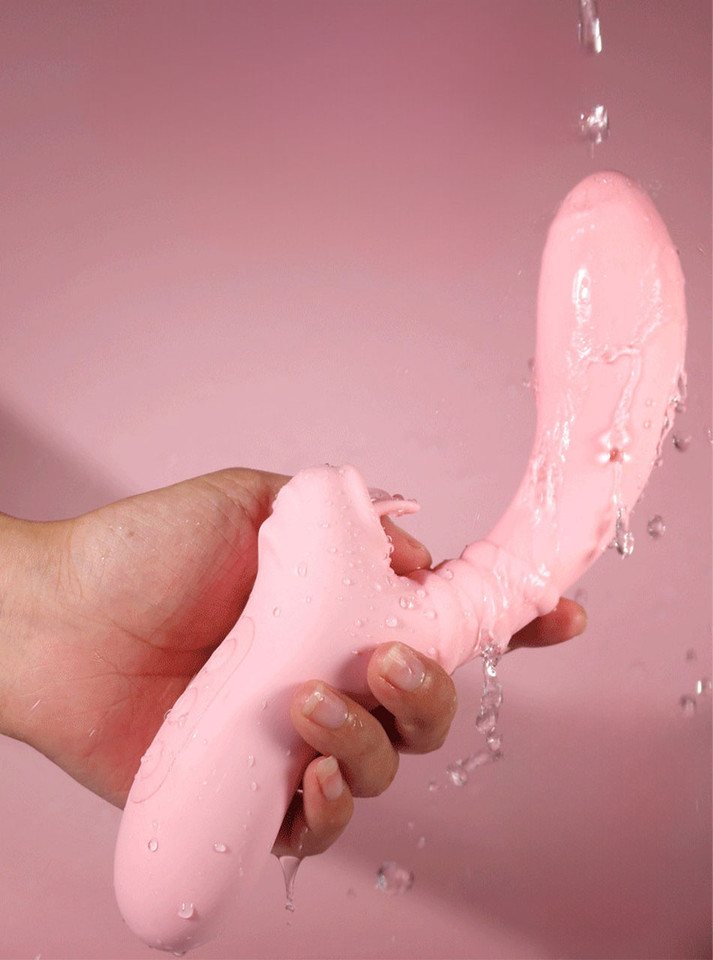 Waterproof light pink tongue-licking massage vibrator being rinsed with water