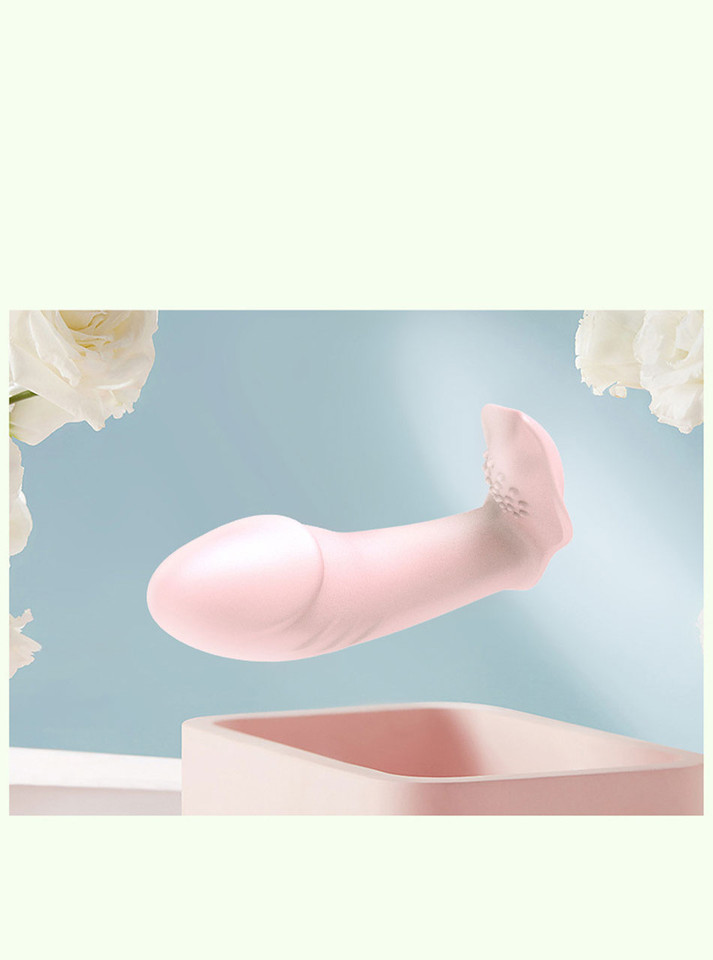 Pink wearable butterfly vibrator displayed on pastel background with curved internal arm and external teaser