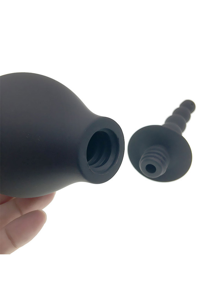 Close up of black silicone anal douche bulb with screw-on removable nozzle