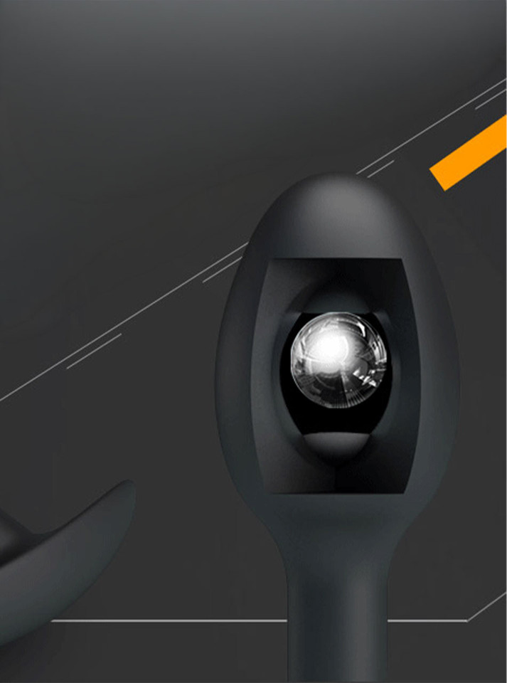 Black silicone butt plug with internal rolling steel ball design