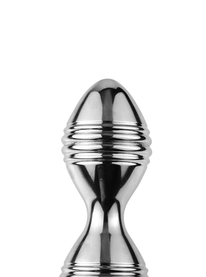 Detailed view of the ridged surface and narrow centre of a polished aluminum alloy Kegel trainer