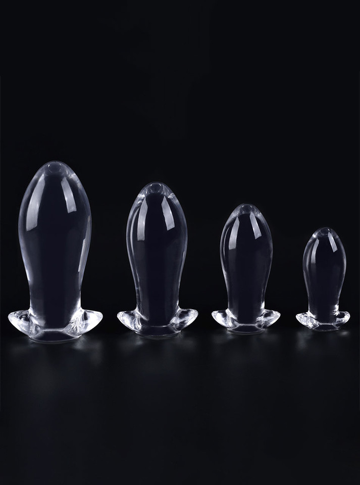 Clear TPE anal dragon egg butt plug size range standing on a black background