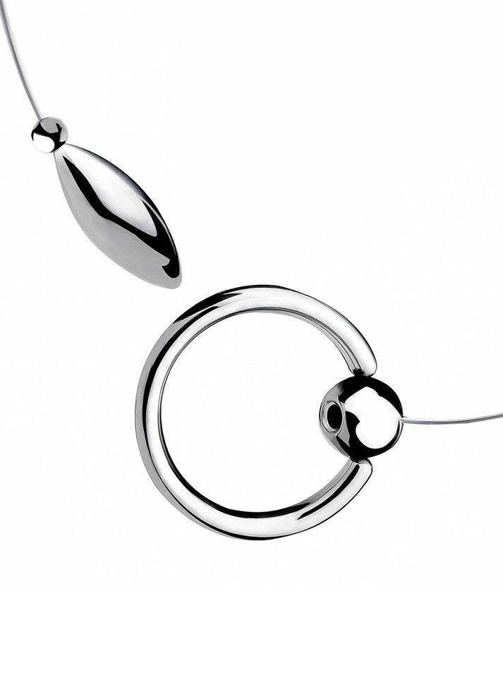 Close-up of 304 stainless steel tethered urethral plug with rigid open cock ring.