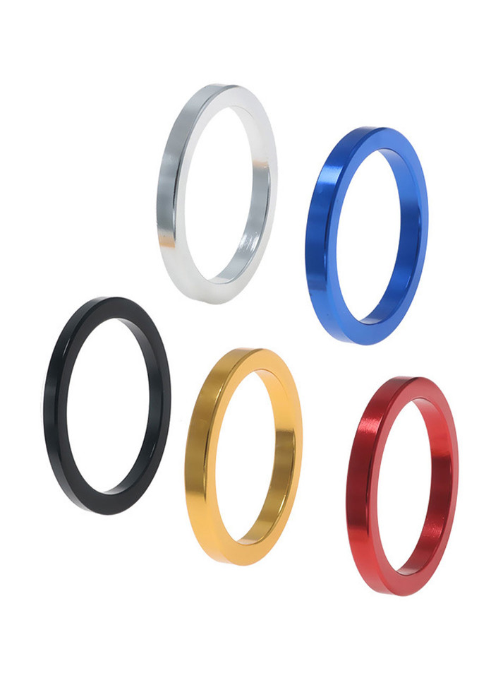 Five polished aluminium cock rings in black, gold, red, blue and silver.