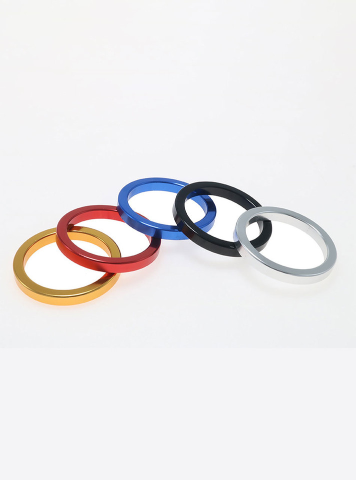 Floating display of five aluminium cock ring colour options.