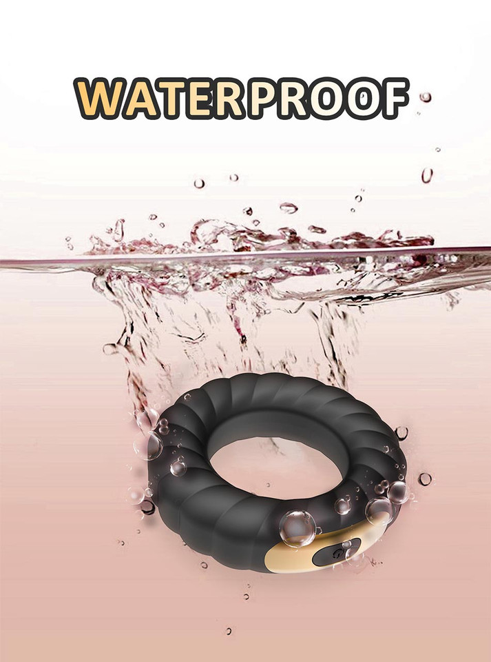 Waterproof black Tire Grip vibrating cock ring with gold control panel shown with water splash graphic.