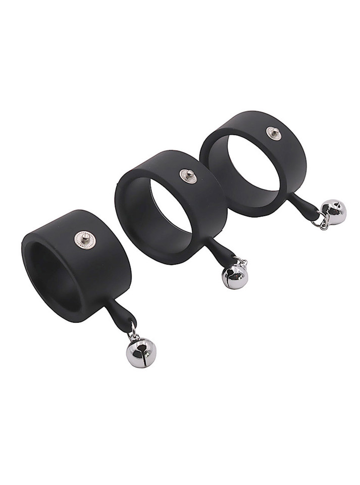 Black e-stim silicone cock rings with snap contact points and bell attachments