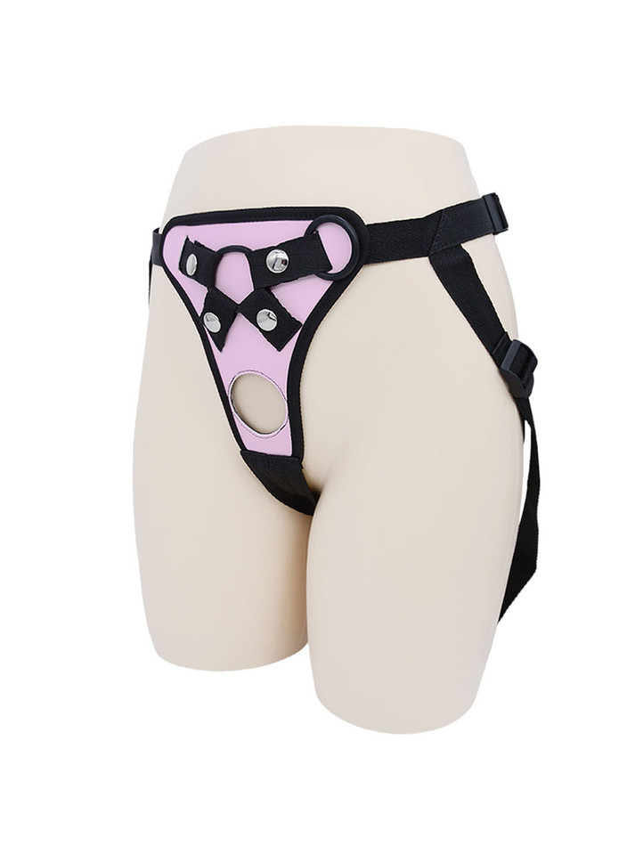 Pink faux leather strap-on harness colour option with black trim, front opening and side straps.